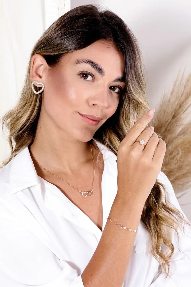 BRINCO CORAÇÃO GRANDE VAZADO CRAVEJADO BANHADO A RÓDIO BRANCO